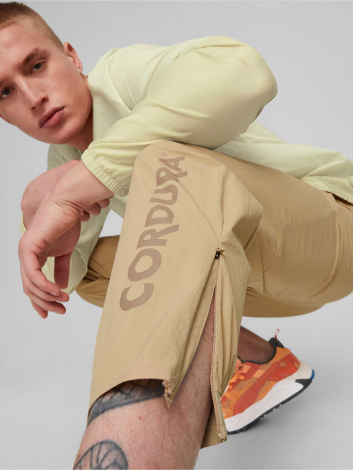 PUMA Спортно долнище TECH Infinite Land Woven