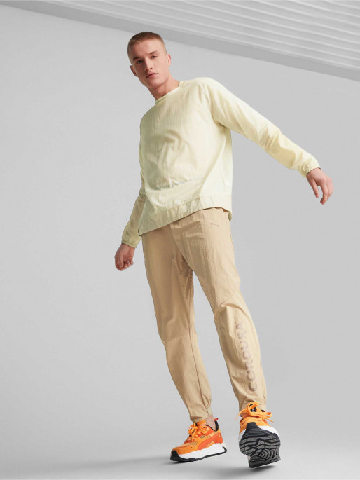 PUMA Спортно долнище TECH Infinite Land Woven