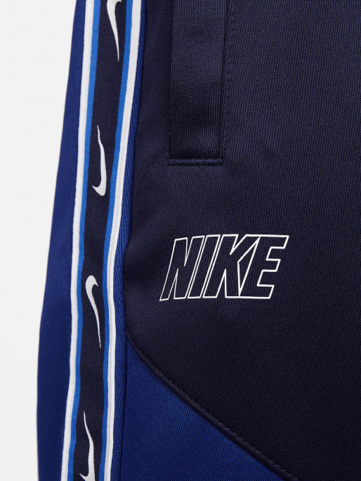 Nike taped poly sale track pants blue